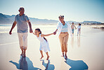 Beach, holding hands and playing, grandparents with girl, family walking on ocean sand together. Fun, vacation and happy senior man and woman with children bonding, quality time and summer in nature.