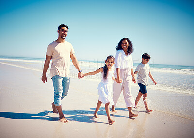 Buy stock photo Beach, family holding hands and parents with kids playing and walking on ocean sand together. Fun, vacation and happy man and woman with children bonding, quality time and summer with mom and dad.