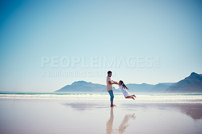 Buy stock photo Mockup, father and daughter playing on the beach together during summer vacation or holiday by the ocean. Sky, sea or view with a man and female child swinging while bonding on the sand at the sea
