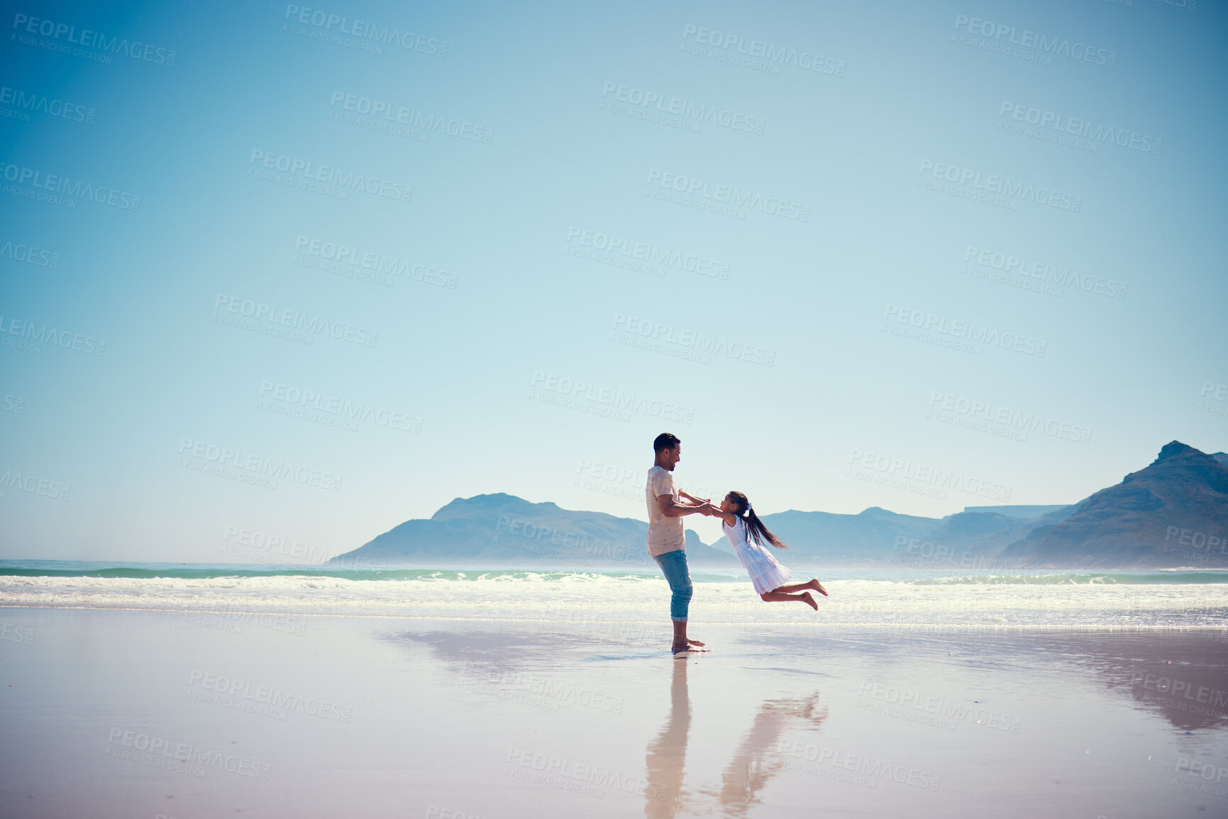 Buy stock photo Mockup, father and daughter playing on the beach together during summer vacation or holiday by the ocean. Sky, sea or view with a man and female child swinging while bonding on the sand at the sea