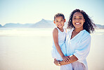 Beach, portrait of mother and child, smile and happy bonding together on ocean vacation in nature. Blue sky, fun and happiness for hispanic woman and daughter on summer holiday adventure in Mexico.