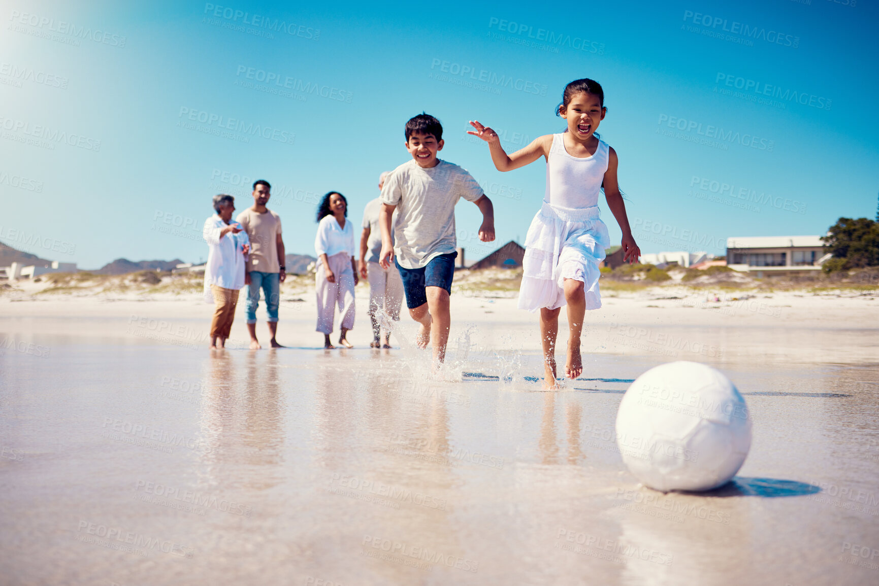 Buy stock photo Family soccer, beach holiday and kids running by the sea with happiness and freedom. Football, young girl and parents walking by ocean in summer on vacation with children on the sand with a smile