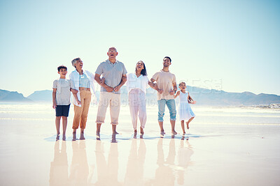 Buy stock photo Portrait of big family on beach walking together, grandparents and parents with kids smile together on vacation. Sun, fun and ocean happiness for hispanic men, women and children on summer holiday.