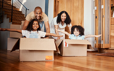 Buy stock photo Children in boxes while moving into a new home with their parents playing in a silly, goofy and fun mood. Happy, smile and family being playful together in their modern house, apartment or property.