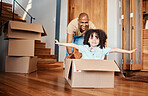 Box, fun and child with father in living room celebrating moving day, rental or real estate. Property, rental and boy with parent, cardboard or airplane game while packing for relocating or new house