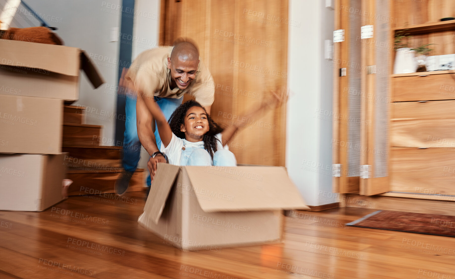 Buy stock photo Fun, box and child with father in living room celebrating moving day, rental or real estate. Property, home and girl with parent, cardboard or airplane game while packing, relocating or new house