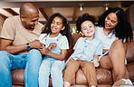 Black family, living room portrait and laughing of a mother, father and kids on a couch with happiness. Happy, parent love and support of girl on in a home sofa together with a smile in a house