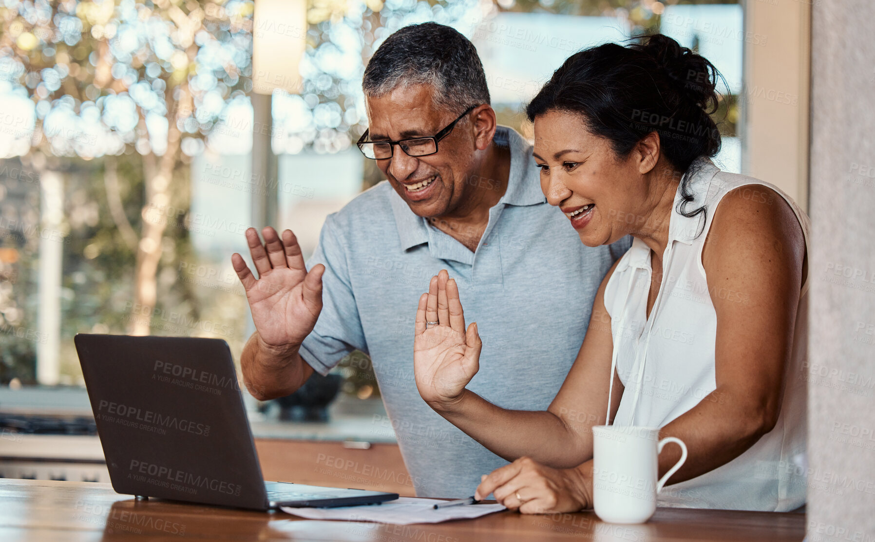 Buy stock photo Laptop, wave and senior couple on video call in home, laughing and talking to contact. Technology, computer and happy, elderly and retired man and woman waving in virtual or online chat for greeting.