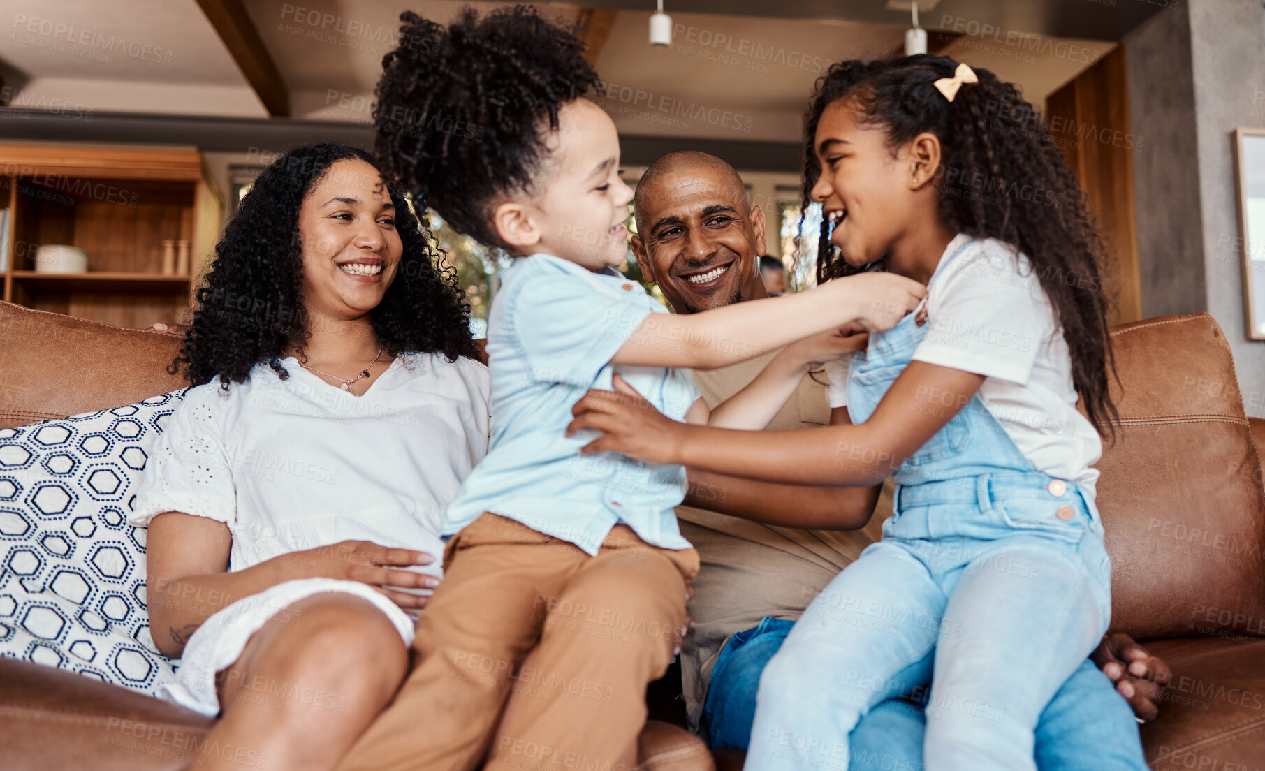 Buy stock photo Happy, tickle and relax with family on sofa for bonding, affectionate and laughing. Funny, free time and smile with parents and children playing in living room at home for care, weekend and games