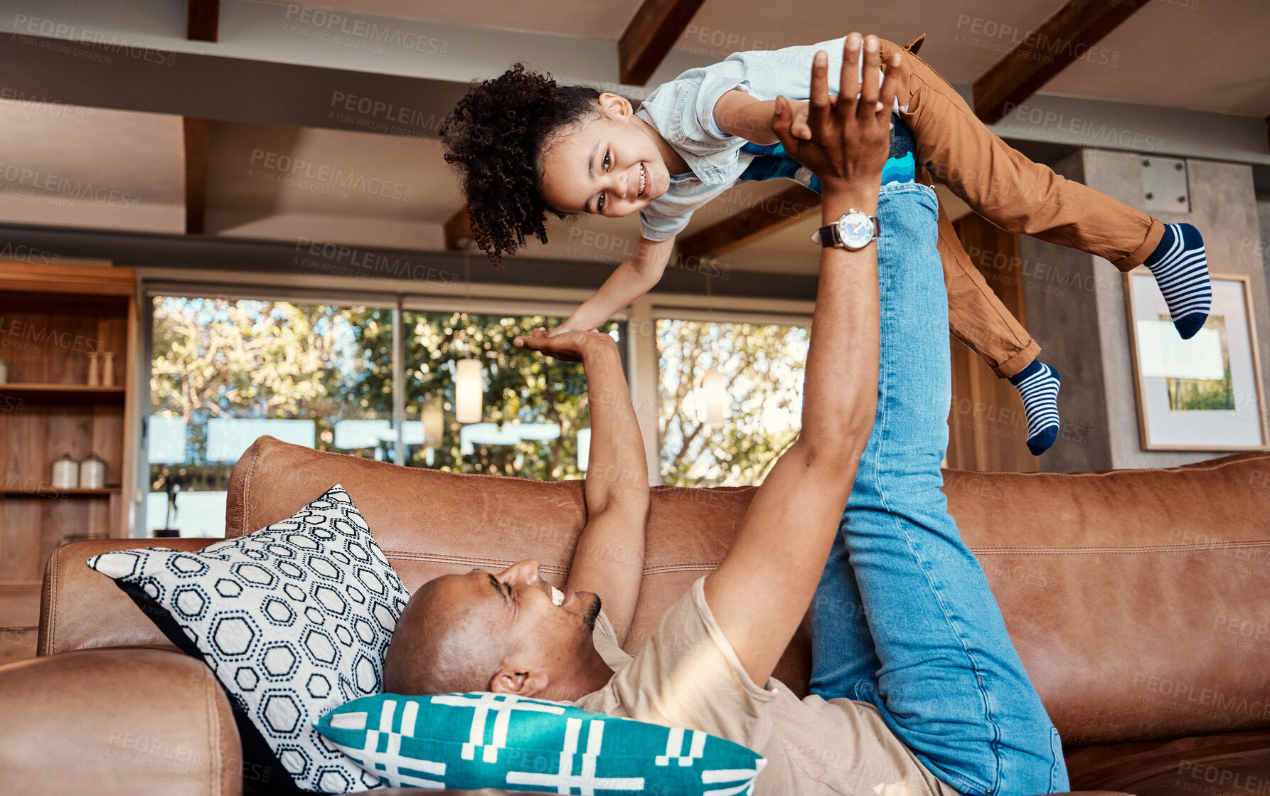 Buy stock photo Airplane, family and father with girl on a sofa for game, playing and bonding in their home together. Fly, love and parent with child in living room, happy and smile while enjoying the weekend inside