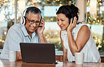 Laptop, headphones and senior couple on video call in home, chatting and talking to contact. Technology, computer and happy, elderly and retired man and woman in virtual conversation or online chat.