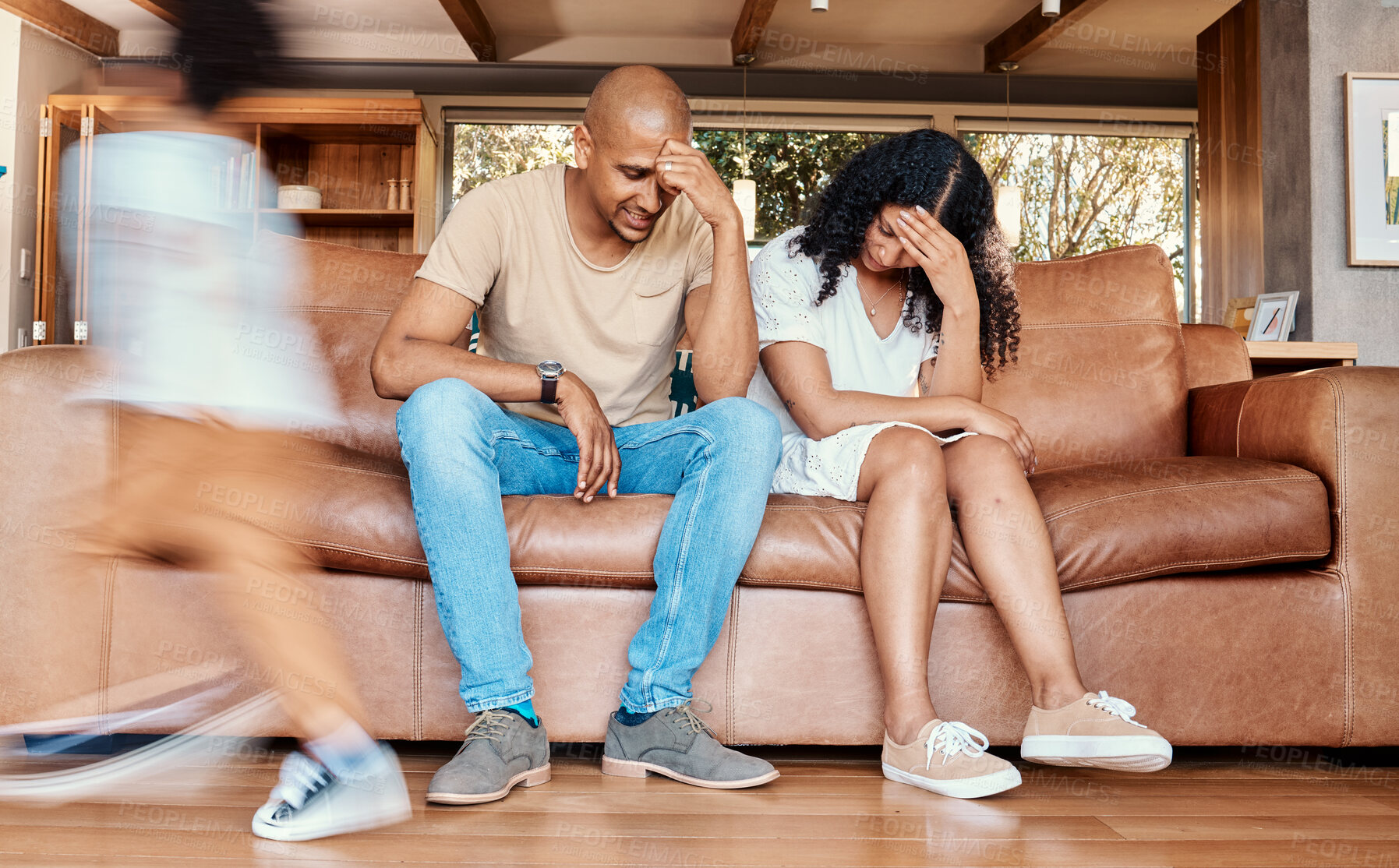 Buy stock photo Kids, stress and mom with dad on sofa tired, chaos in living room or frustrated mother and father with parenting burnout. Hyperactive children with energy playing in home with woman and man in crisis