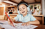 Creative, headphones and girl drawing a picture while listening to music, audio book or radio. Art, artistic and young kid writing on paper for homework while streaming song, album or playlist.