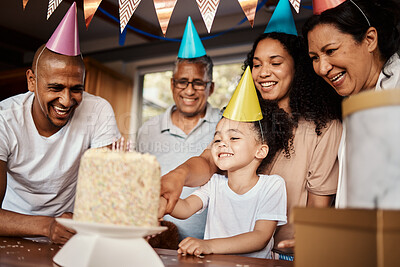 Buy stock photo Birthday, black family and a girl cutting cake in the home during a party or celebration together. Kids, event or love with parents, grandparents and a daughter bonding or celebrating in a house