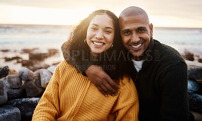 Buy stock photo Romantic, happy and portrait of a couple at the beach for a date, bonding or sunset in Bali. Love, hug and young man and woman smiling while relaxing at the ocean for vacation or an anniversary