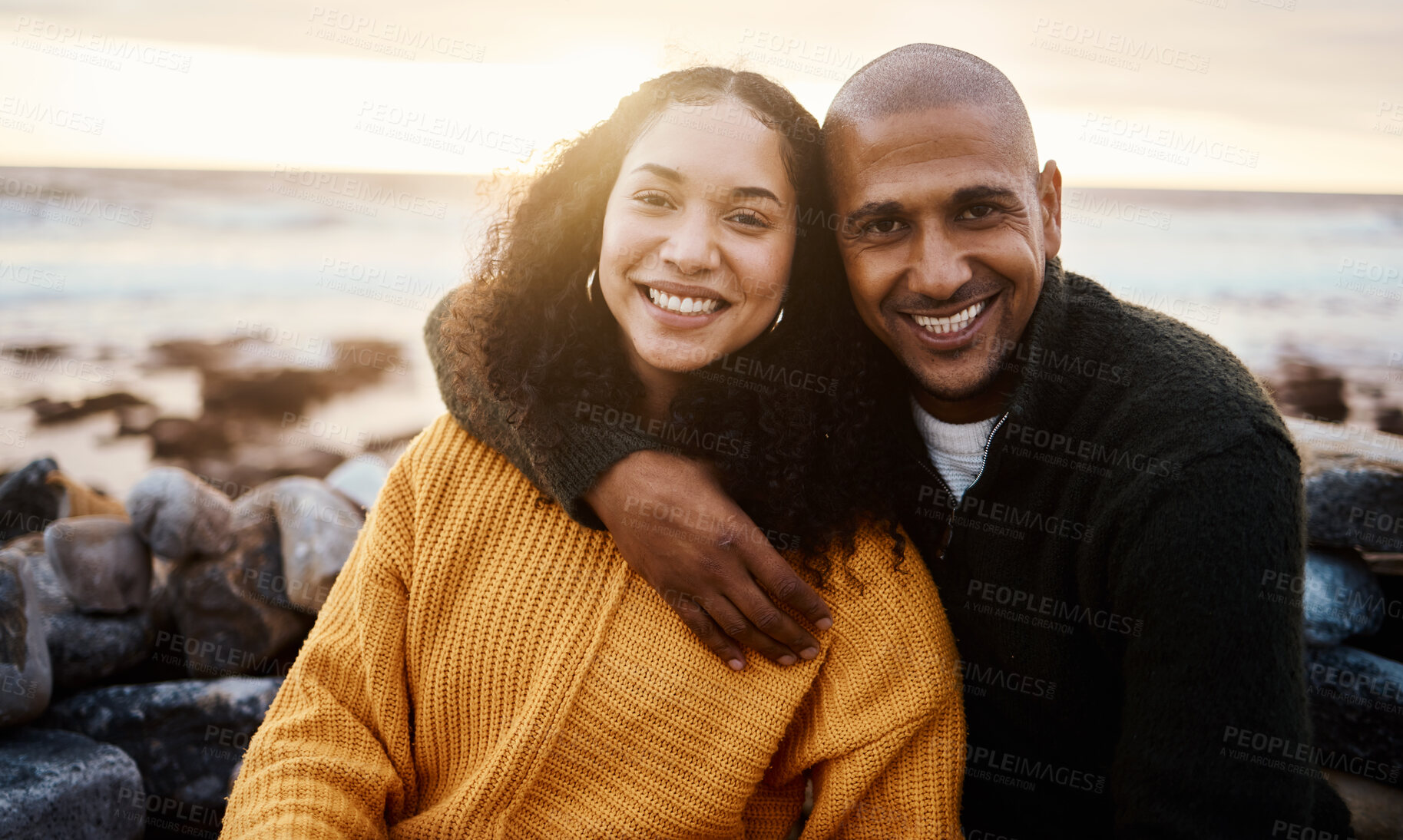 Buy stock photo Romantic, happy and portrait of a couple at the beach for a date, bonding or sunset in Bali. Love, hug and young man and woman smiling while relaxing at the ocean for vacation or an anniversary