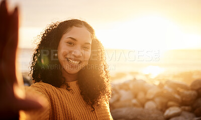 Buy stock photo Selfie, sunset and mockup with a black woman on the beach during summer for a holiday or vacation. Portrait, sunrise and flare with an attractive young female posing for a photograph on the coast