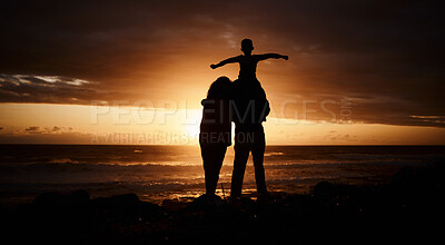 Buy stock photo Sunset, beach and silhouette of parents with child by ocean for bonding, quality time and peace. Happy family, nature and back of mother, father and kid on shoulder on vacation, holiday and weekend