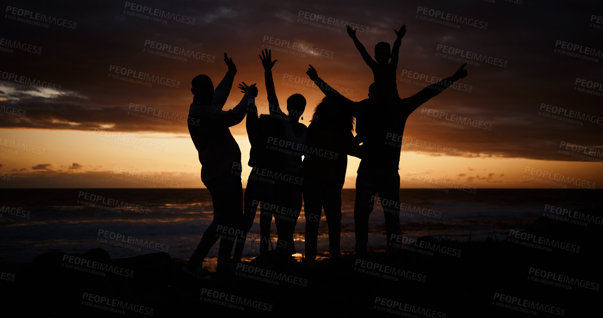 Buy stock photo Freedom, sunset and silhouette of people at the beach while on a summer vacation, adventure or weekend trip. Carefree, happy and shadow of group of friends having fun together by the ocean on holiday