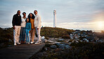 Lighthouse, family portrait walking and nature adventure on a holiday at sunset by the sea. Ocean, beach walk and outdoor with a mom, father and child together with love and parents support at dusk