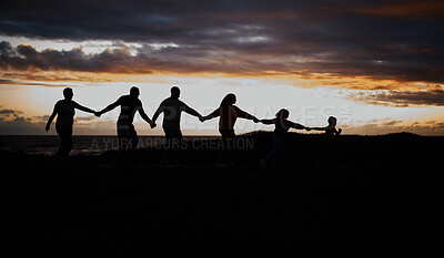 Buy stock photo Sunset, beach and silhouette of family with children by ocean for bonding, quality time and peace. Shadow, nature and grandparents, parents and kids holding hands on vacation, holiday and weekend