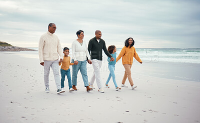 Buy stock photo Grandparents, parents and children walking on beach enjoying holiday, travel vacation and weekend together. Big family, nature and happy people holding hands for bonding, quality time and love by sea