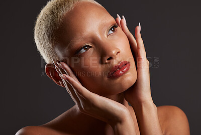 Buy stock photo Beauty, makeup and cosmetics, black woman looking up in dark studio with platinum hair isolated on grey background. Art aesthetic, cosmetics and beautiful African model in skin glow and luxury facial