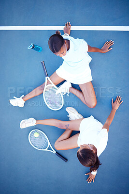 Buy stock photo Top view, tennis and women tired, conversation and exhausted after match, training and happiness for sport. Female athletes, players or friends with rackets, workout or practice for healthy lifestyle