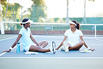 Teamwork, tennis and black women talking on court after match, game or competition. Sports, collaboration and smile of happy friends, athletes or girls chatting or conversation after training workout