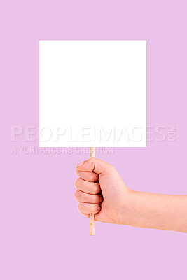 Buy stock photo Hands, billboard and mockup for advertising, branding or marketing against a pink studio background. Hand holding stick poster, placard or empty banner for message, text or logo brand on copy space