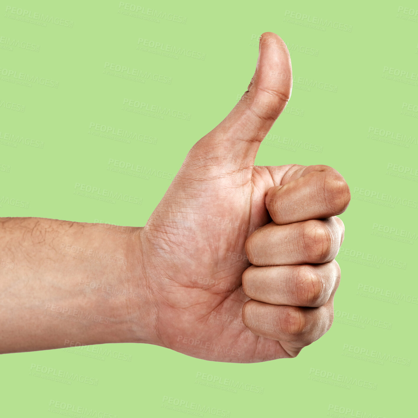 Buy stock photo Hands, thumbs up and like emoji, yes sign or agree gesture against a green studio background. Hand of person showing thumb for success, winning or support for luck, good job or thanks in trust