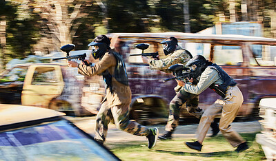 Buy stock photo Team, paintball and army moving on the attack in extreme adrenaline sport, battle or war in the nature outdoors. Group of paintballers or soldiers in rush aiming down sights in teamwork engagement