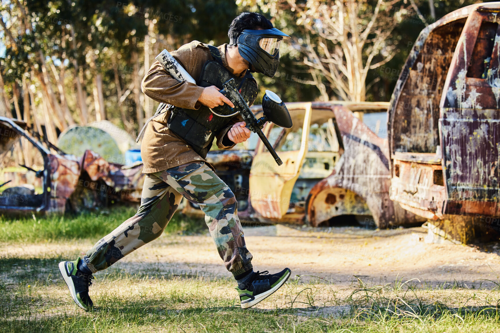 Buy stock photo Paintball player or man running with gun, outdoor competition or games in forest adventure or military training. Army skill, fitness or sports person in shooting battlefield, action or target mission