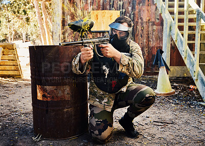 Buy stock photo Paintball, target training or male with gun in shooting game playing with on fun battlefield mission. Aim or focused man with army weapons gear for survival in outdoor challenge competition 