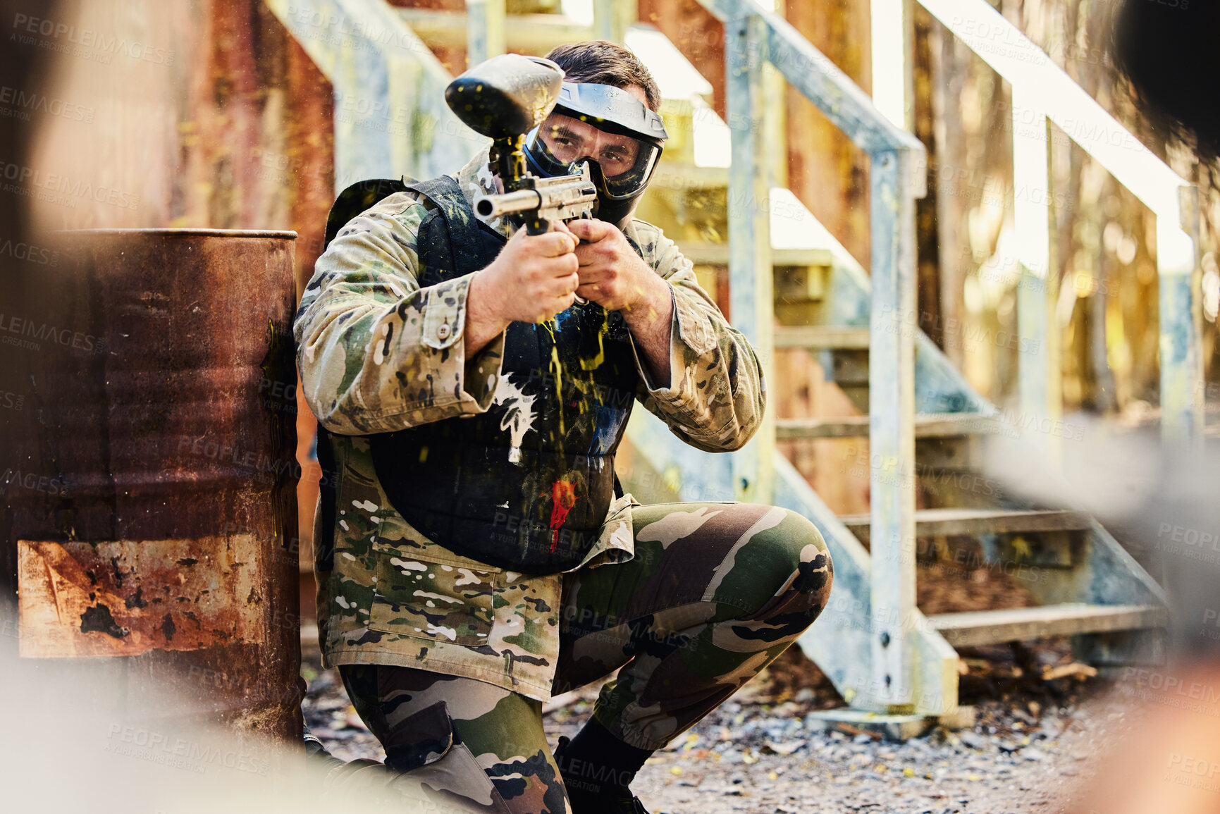 Buy stock photo Paintball, target training or male soldier with gun in shooting game playing with on fun battlefield mission. Aim or focused man with army weapons gear for survival in outdoor challenge competition 