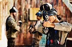 Paintball, target training or woman with gun in shooting game playing with on fun battlefield mission. Aim, hero or focused soldier with army weapons gear in survival military challenge competition