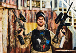 Paintball, laughing or portrait of happy man with guns in shooting game playing or celebrates battlefield mission. Crazy or funny soldier with army weapons gear winning military challenge competition