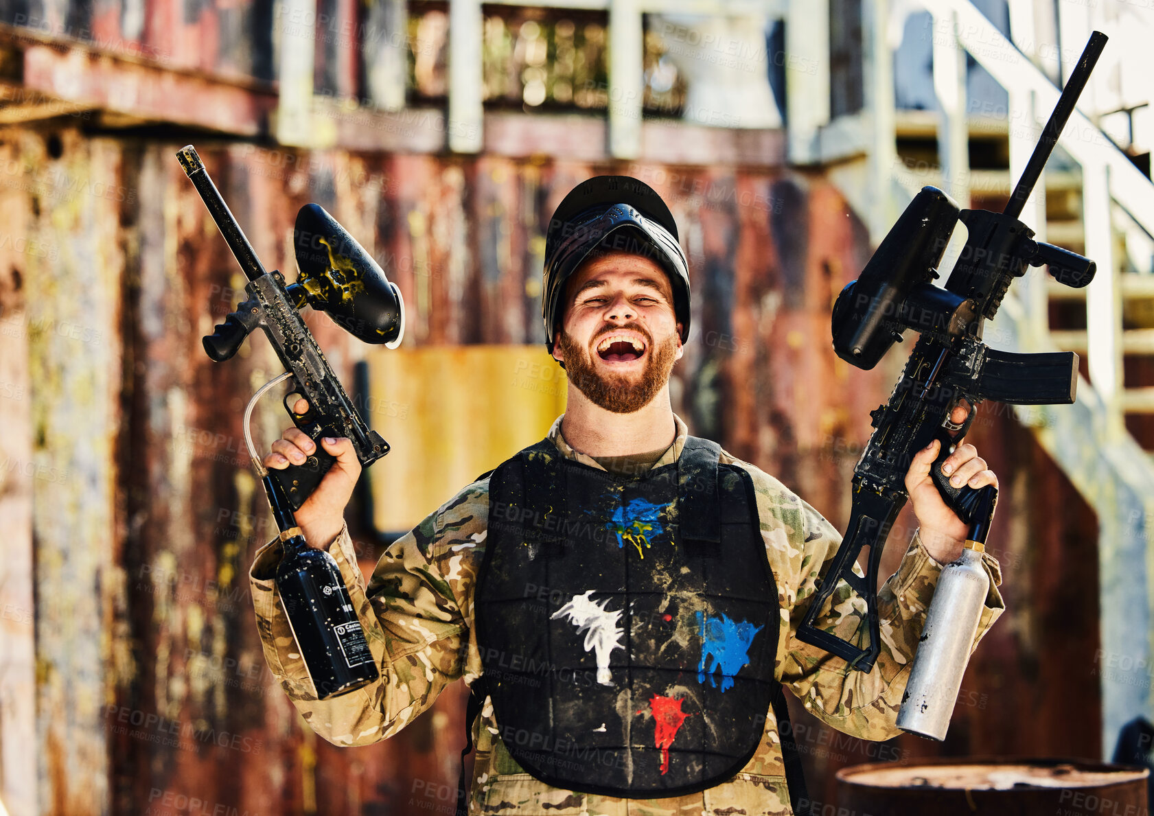 Buy stock photo Paintball, laughing or portrait of happy man with guns in shooting game playing or celebrates battlefield mission. Crazy or funny soldier with army weapons gear winning military challenge competition