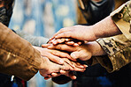 Motivation, paintball team or hands in huddle on a mission, strategy or soldier training on war battlefield. Goals, collaboration or army people with support in partnership or military group solidarity 