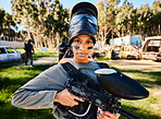 Paintball, serious or portrait of woman with gun in shooting game playing in action battlefield mission. War, hero or focused soldier with army weapons gear in survival military challenge competition