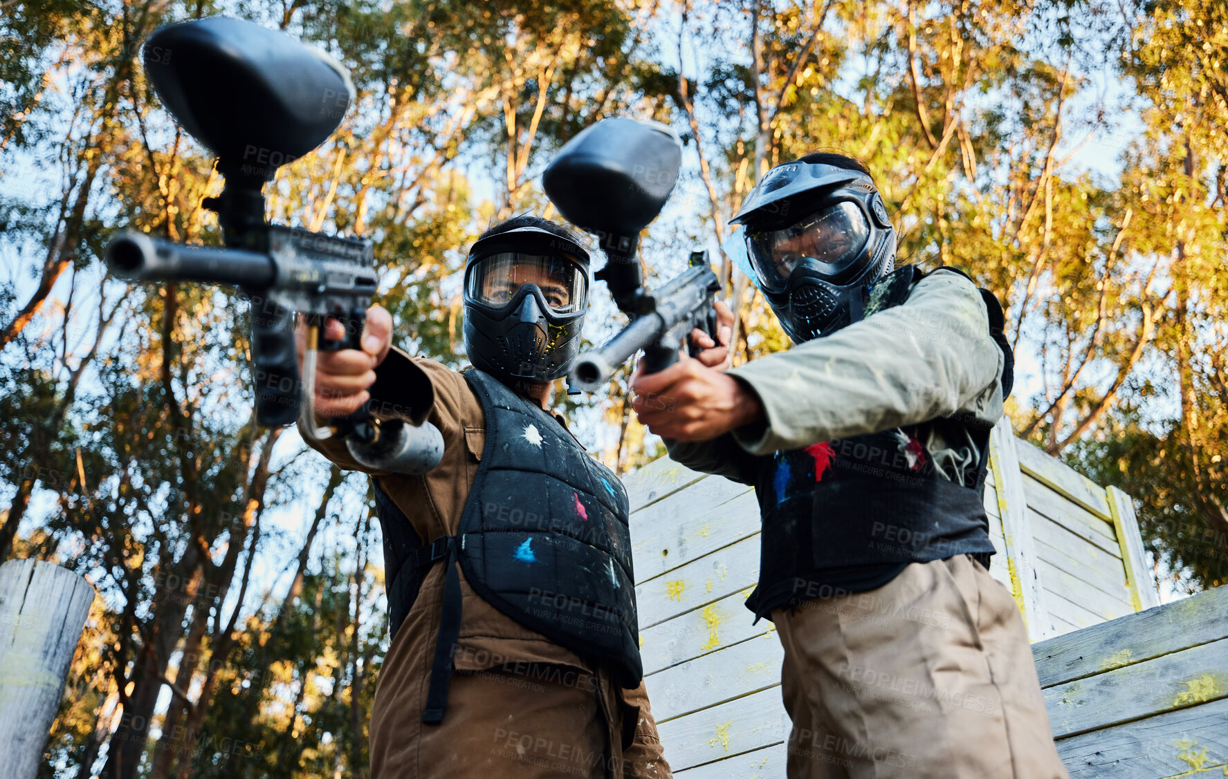 Buy stock photo Paintball, sports teamwork and men with gun for game, battle or competition. Collaboration, portrait or cooperation of people or friends on shooting range ready for target, aim practice and training