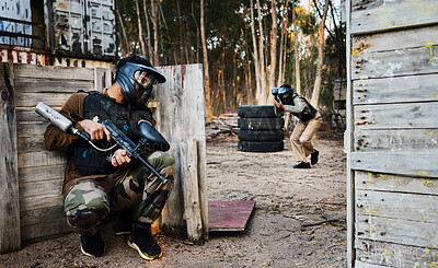 Buy stock photo Sports, paintball and man with gun for battle, game or competition outdoors on field. War, military camouflage and male soldier with weapon on shooting range to hide from player in exercise fight.