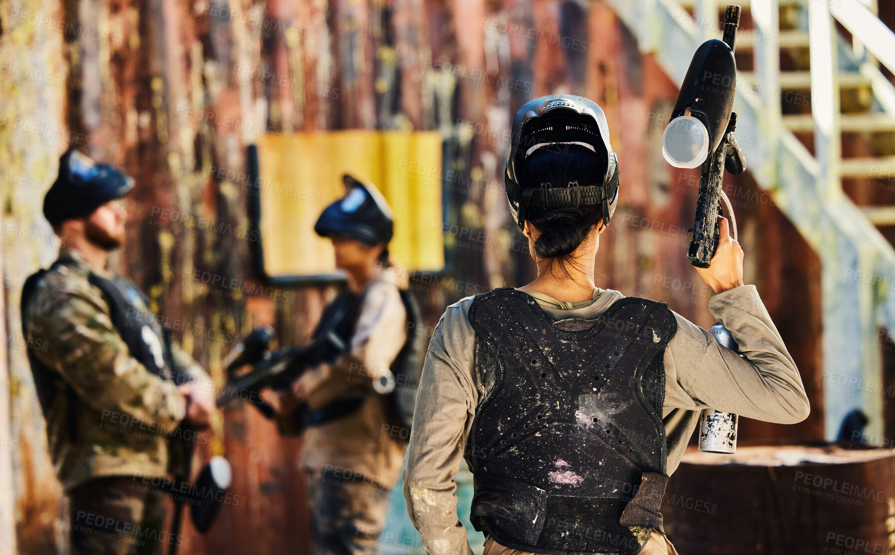 Buy stock photo Paintball, back view or woman with gun in game or competition for fitness, exercise or cardio workout. War soldier, challenge or female warrior with army weapon or marker for military target training