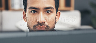 Buy stock photo Face, focus and a business man at work on a computer in his office closeup for the company mission. Eyes, mindset and serious with a young male employee working on a desktop pc for administration