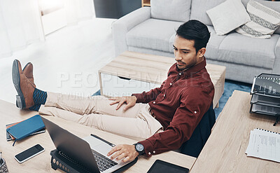 Buy stock photo Work from home man with feet up on desk working on laptop for job confidence, productivity and online career. Asian remote worker, entrepreneur or professional person relaxing and typing on computer