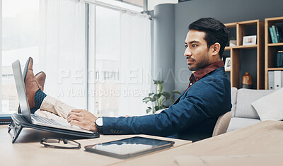 Buy stock photo Relax business man with his feet up on desk working on laptop for job confidence, productivity and successful career. Serious Asian CEO, boss or professional person relaxing in office on computer