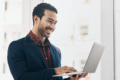 Buy stock photo Corporate asian man, laptop typing and smile in office for email communication, chat or social media. Entrepreneur, businessman and happy with computer for web design, chat or funny meme on internet