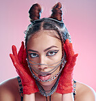Chains, fashion and face of goth woman with unique style isolated against a studio pink background. Portrait, accessories and edgy female model metal jewelry on her head and cool makeup
