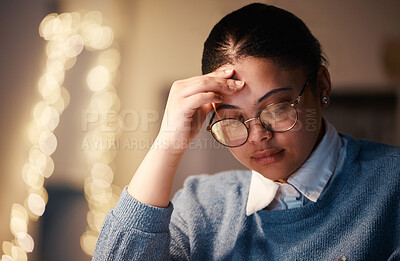 Buy stock photo Hispanic woman, study headache and education burnout of a student with stress. Night thinking, online university project and anxiety of a young female with glasses and blurred background in the dark