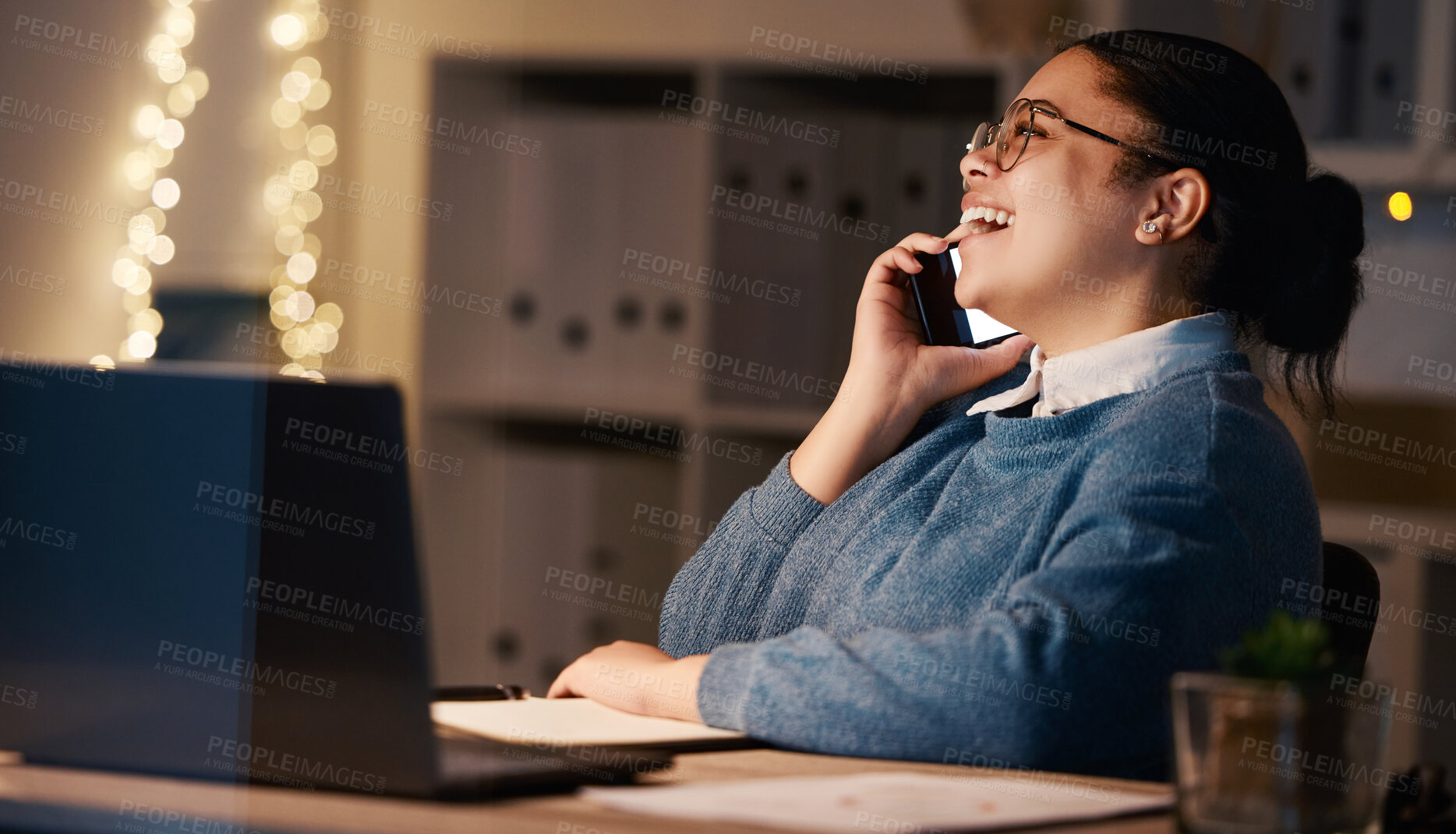 Buy stock photo Business woman, phone call and laughing in office at night, chatting or speaking to contact. Bokeh, overtime or happy female employee with mobile smartphone for funny conversation or comic discussion